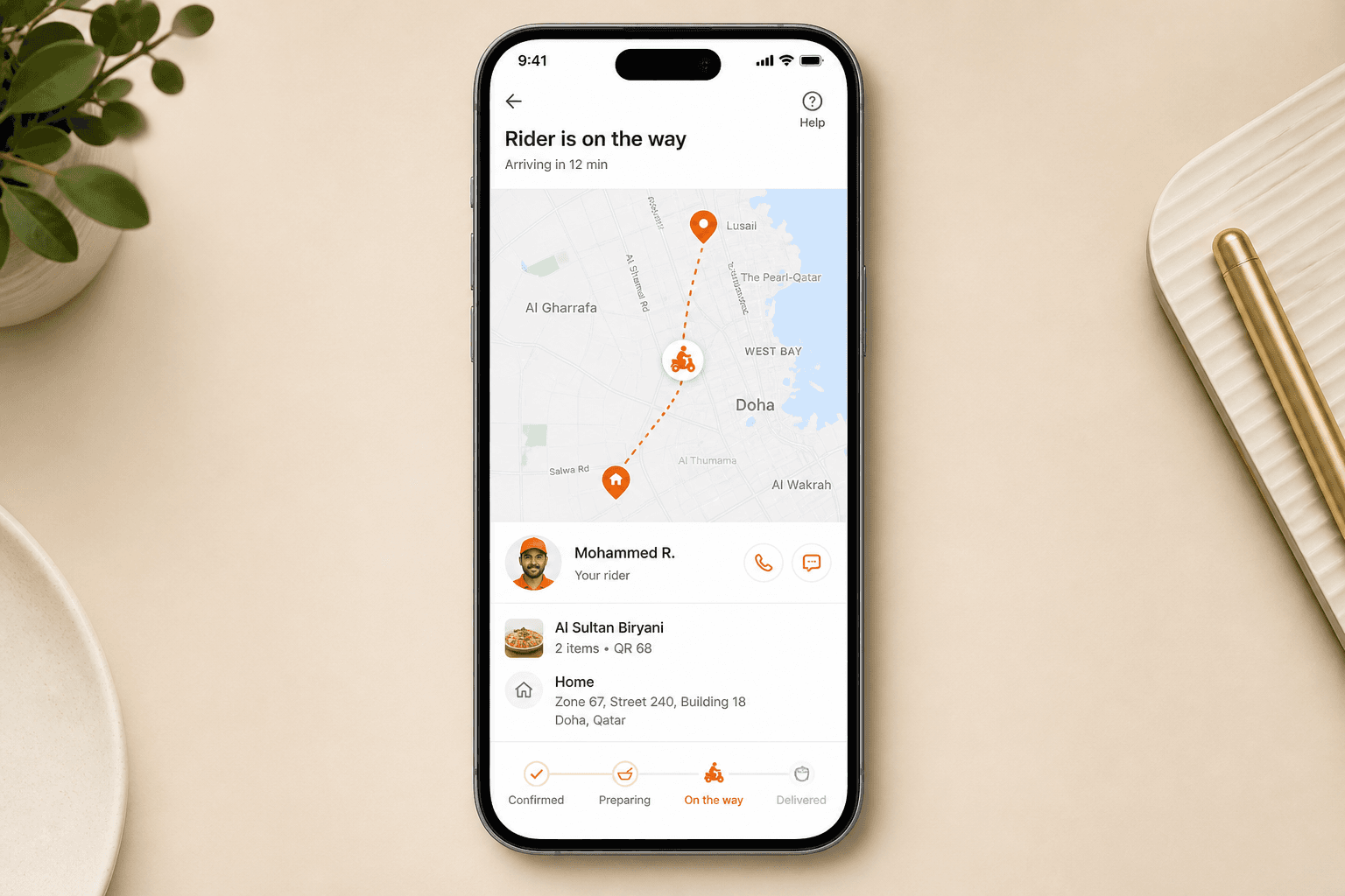 Delivery rider tracking screen with live map in a Qatar food delivery app