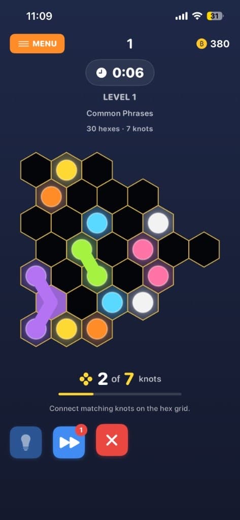 Hex knot puzzle in progress with connected green and purple paths